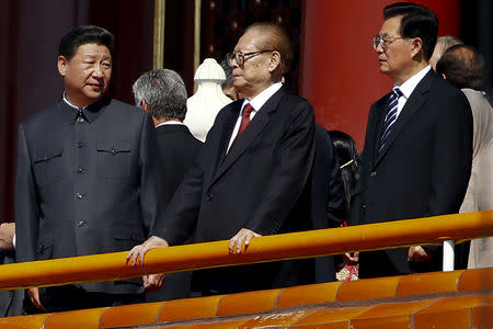 FILE PHOTO - Former Chinese President Jiang Zemin stands between President Xi Jinping (L) and former President Hu Jintao (R) during a military parade to mark the 70th anniversary of the end of World War Two, in Beijing, China, September 3, 2015. REUTERS/Damir Sagolj/File Photo