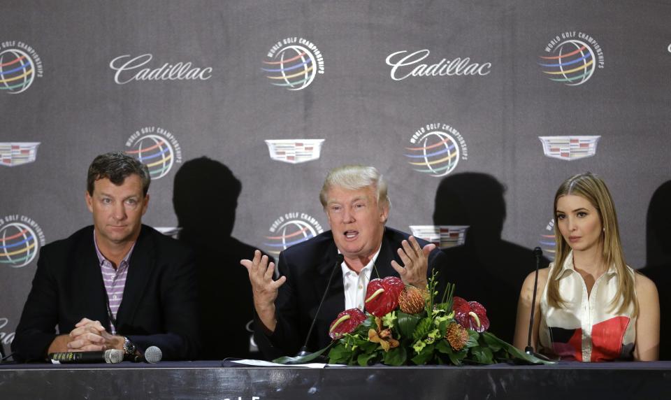 Donald Trump, center, speaks during a news conference, joined by his daughter Ivanka, right, and course architect Gil Hanse, left, about the redesign of the Blue Monster course, site of the Cadillac Championship golf tournament, Wednesday, March 5, 2014, in Doral, Fla. (AP Photo/Wilfredo Lee)