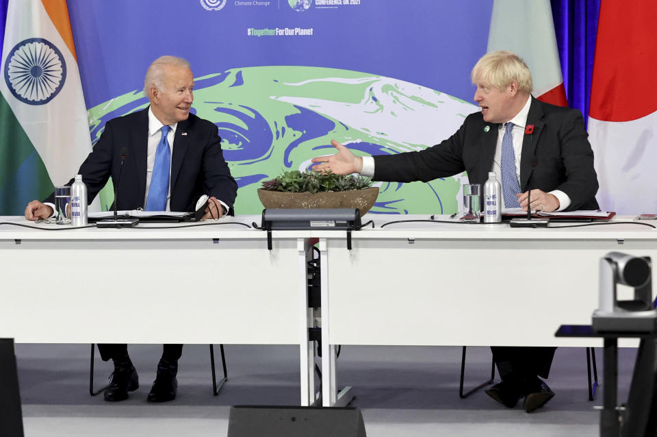 British Prime Minister Boris Johnson, right, and U.S. President Joe Biden attend the COP26 Summit, at the SECC in Glasgow, Scotland, Tuesday, Nov. 2, 2021. The U.N. climate summit in Glasgow gathers leaders from around the world, in Scotland's biggest city, to lay out their vision for addressing the common challenge of global warming. (Steve Reigate /Pool Photo via AP)