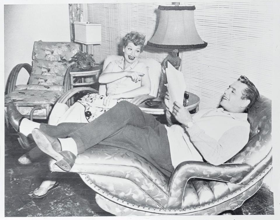 <p>Lucille and Desi relax on set while reviewing a script for that week's episode. Since the couple not only stared in <em>I Love Lucy</em>, but also produced it through their company, Desilu Productions, they had major control over the program. </p>