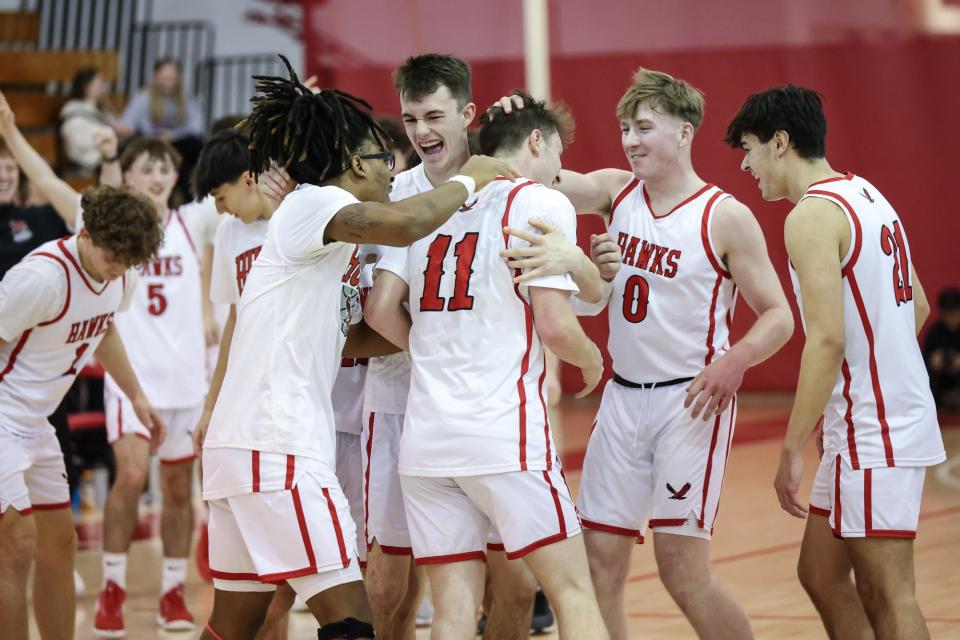 Hudson celebrates senior captain Jackson O'Brien’s one-thousandth point during the CMADA playoff game against Northbridge at Hudson High School on Feb. 17, 2024.