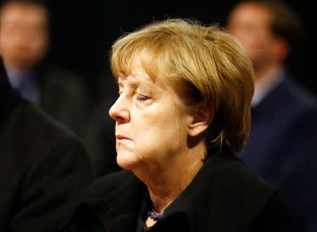 German Chancellor Angela Merkel reacts before she signs the condolence book at the Gedaechniskirche in Berlin, Germany, December 20, 2016, one day after a truck ploughed into a crowded Christmas market in the German capital. REUTERS/Hannibal Hanschke