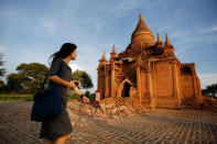 <p>A woman walks past a damaged pagoda after an earthquake in Bagan, Myanmar August 25, 2016. (REUTERS/Soe Zeya Tun) </p>