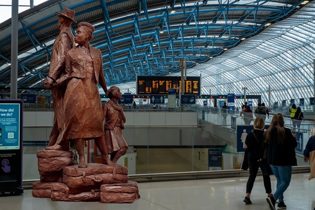The 12ft-high statue will be unveiled at Waterloo station and shows of a man, woman and child dressed in their Sunday best (Basil Watson)