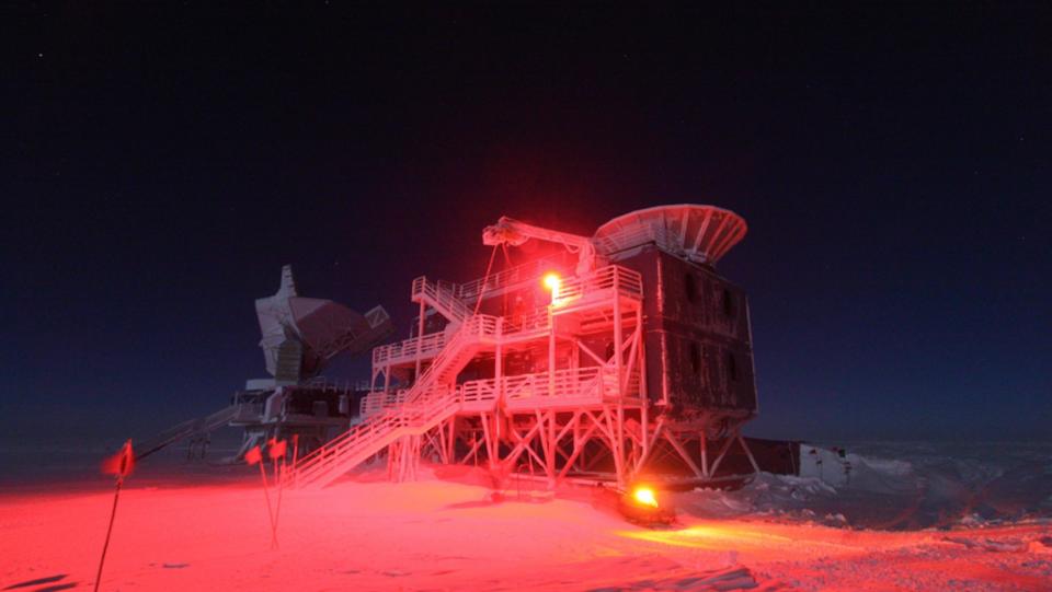 The BICEP2 telescope at the South Pole illuminated during a winter darkness, which lasts for nearly six months straight. <cite>Robert Schwarz/University of Minnesota</cite>