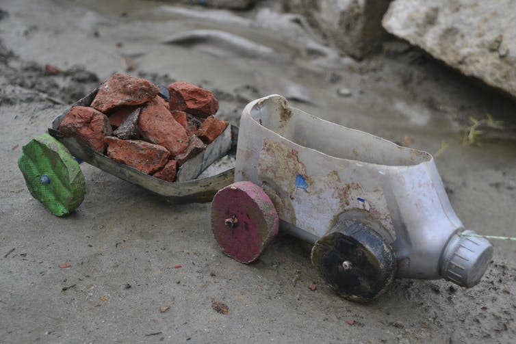 <span class="caption">An innovative tractor and trailer toy made by local children out of empty plastic bottles.</span> <span class="attribution"><span class="source">Sonja Ayeb-Karlsson</span></span>