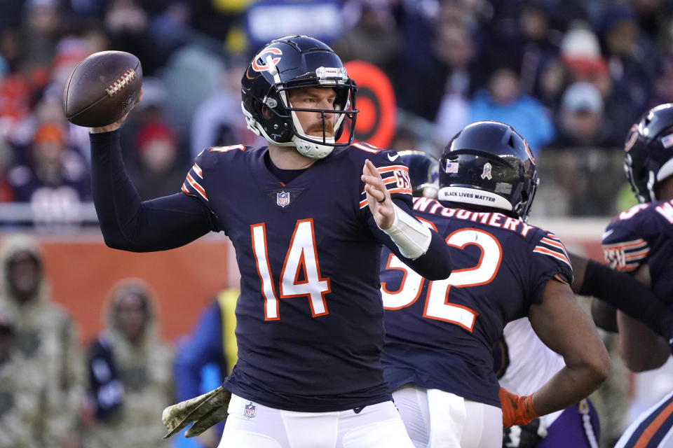 Chicago Bears quarterback Andy Dalton throws a touchdown pass to Darnell Mooney during the second half of an NFL football game against the Baltimore Ravens Sunday, Nov. 21, 2021, in Chicago. (AP Photo/David Banks)