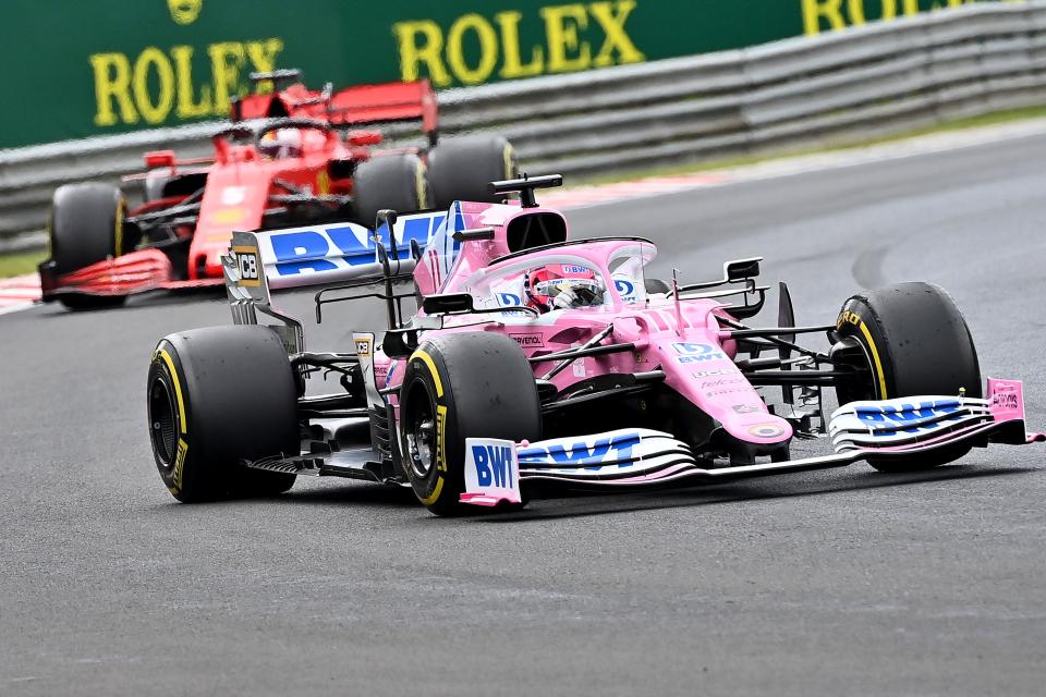 Racing Point's Mexican driver Sergio Perez steers his car in front of Ferrari's German driver Sebastian Vettel driver Charles Leclerc during the Formula One Hungarian Grand Prix race at the Hungaroring circuit in Mogyorod near Budapest, Hungary, on July 19, 2020. (Photo by Joe Klamar / POOL / AFP) (Photo by JOE KLAMAR/POOL/AFP via Getty Images)