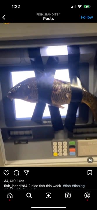 This is a screenshot showing an Instagram post where a fish is taped to an ATM.