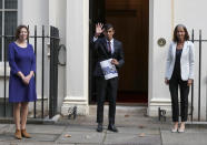 Britain's Chancellor of the Exchequer Rishi Sunak, centre, poses for photographers with Dame Carolyn Julie Fairbairn, right, Director General of the CBI, Confederation of British Industry, and Frances O'Grady, General Secretary of the TUC, Trades Union Congress, outside No 11 Downing Street, before heading for the House of Commons to give MPs details of his Winter Economy Plan, in London, Thursday Sept. 24, 2020. (AP Photo/Frank Augstein)