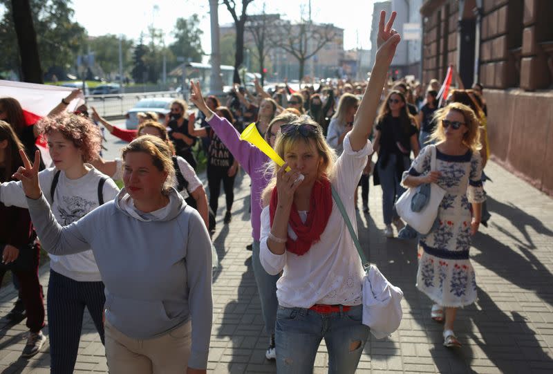 Belarusian opposition supporters hold a rally in Minsk