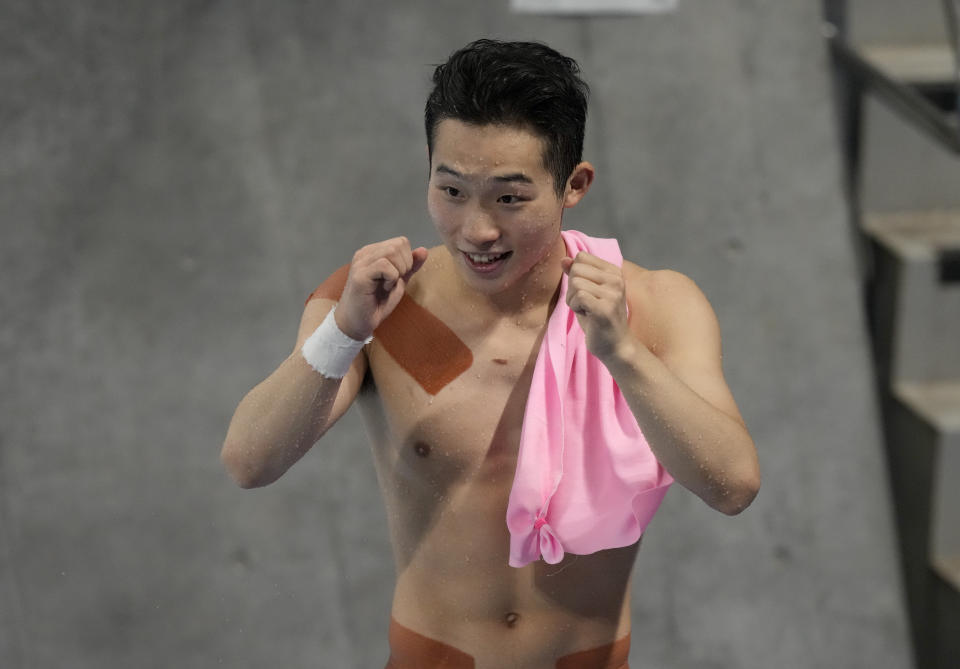 Wang Zongyuan of China reacts after winning silver medal competes in men's diving 3m springboard final at the Tokyo Aquatics Centre at the 2020 Summer Olympics, Tuesday, Aug. 3, 2021, in Tokyo, Japan. (AP Photo/Dmitri Lovetsky)