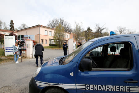 French gendarmes stand at the entrance of the "La Cheneraie" EHPAD (Housing Establishment for Elderly Dependant People) care home following the deaths of five people as a result of suspected food poisoning in Lherm, southern France, April 1, 2019. REUTERS/Regis Duvignau