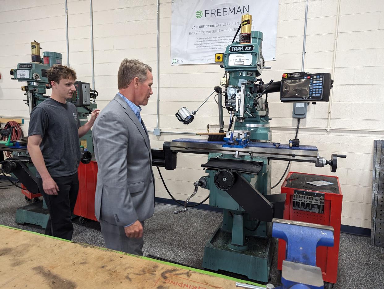 Lt. Gov. Jon Husted, left front, visited the Fremont campus of the Vanguard Sentinel Career and Technology Center on Wednesday. He talks with Jaden Isaacs, a student in the AIM Manufacturing program, and working at Pegasus Vans & Trailers in welding and fabrication.