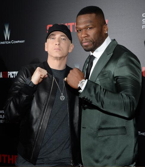 Eminem, left, and 50 Cent attend the premiere of "Southpaw" at the AMC Loews Lincoln Square on Monday, July 20, 2015, in New York. (Photo by Evan Agostini/Invision/AP)