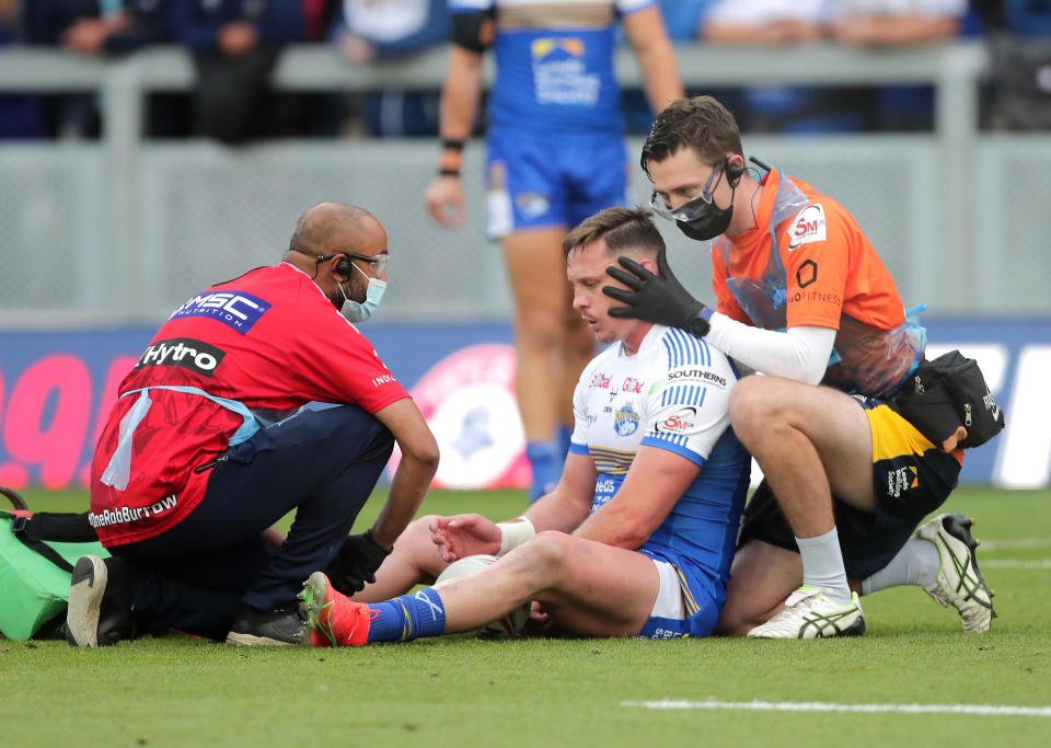 <p>Leeds Rhinos' James Donaldson receives treatment for a possible head injury during the Betfred Super League match at Emerald Headingley Stadium, Leeds. Picture date: Sunday August 1, 2021.</p>
