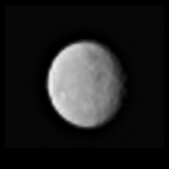 A zoomed-in view of the dwarf planet Ceres, seen from a distance of 238,000 miles (383,000 kilometers) by the Dawn spacecraft on Jan. 13, 2015. The image hints at the presence of craters and other features on Ceres' surface.