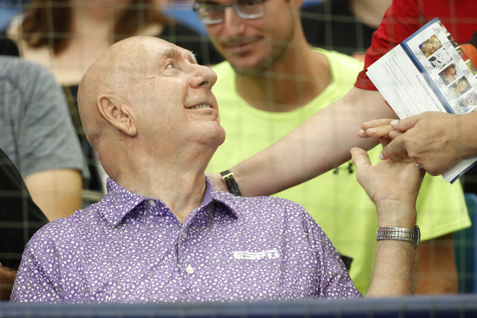 ESPN basketball broadcaster Dick Vitale talks with a fan before the start of a baseball game between the Tampa Bay Rays and the Baltimore Orioles, Sunday, July 23, 2023, in St. Petersburg, Fla. (AP Photo/Scott Audette)