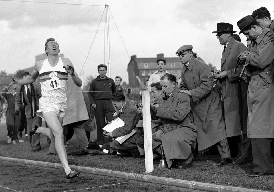 <span class="caption">In May 1954, Roger Bannister hits the tape to become the first person to break the four-minute mile in Oxford, England.</span> <span class="attribution"><span class="source">(AP Photo)</span></span>