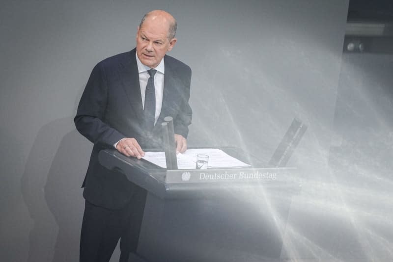 German Chancellor Olaf Scholz makes a government statement on the "current security situation" in a plenary session of the German Bundestag. Kay Nietfeld/dpa