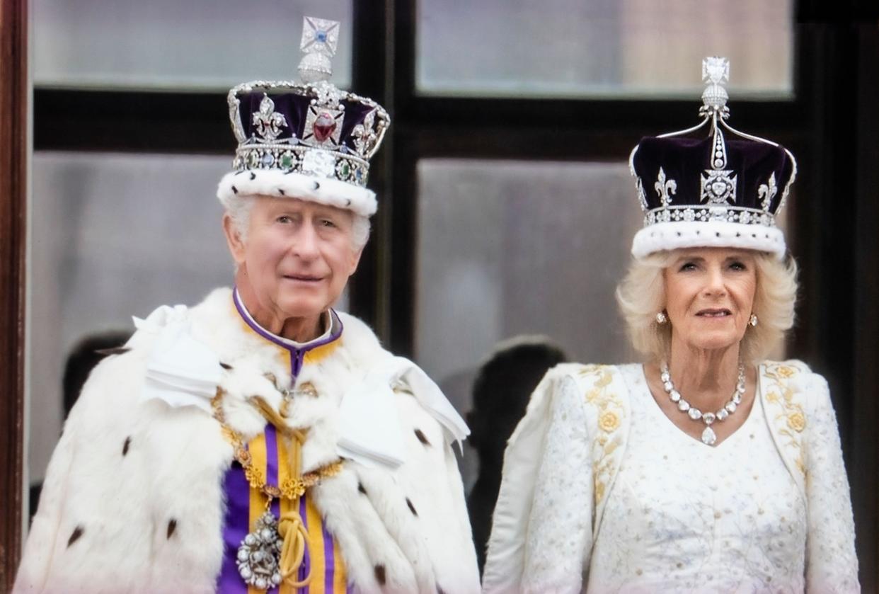 King Charles III and Queen Camilla wearing their crowns, on the balcony of Buckinham Palace watch the flypast in honour of their Coronation at Westminster Abbey Westminster London May 6th 2023