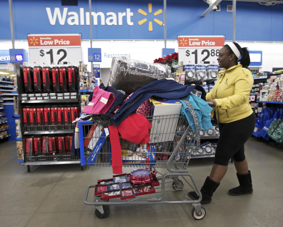 Tasha heads to checkout at a Walmart Store in Chicago, November 23, 2012. Black Friday, the day following the Thanksgiving Day holiday, has traditionally been the busiest shopping day in the United States. (REUTERS/John Gress) 