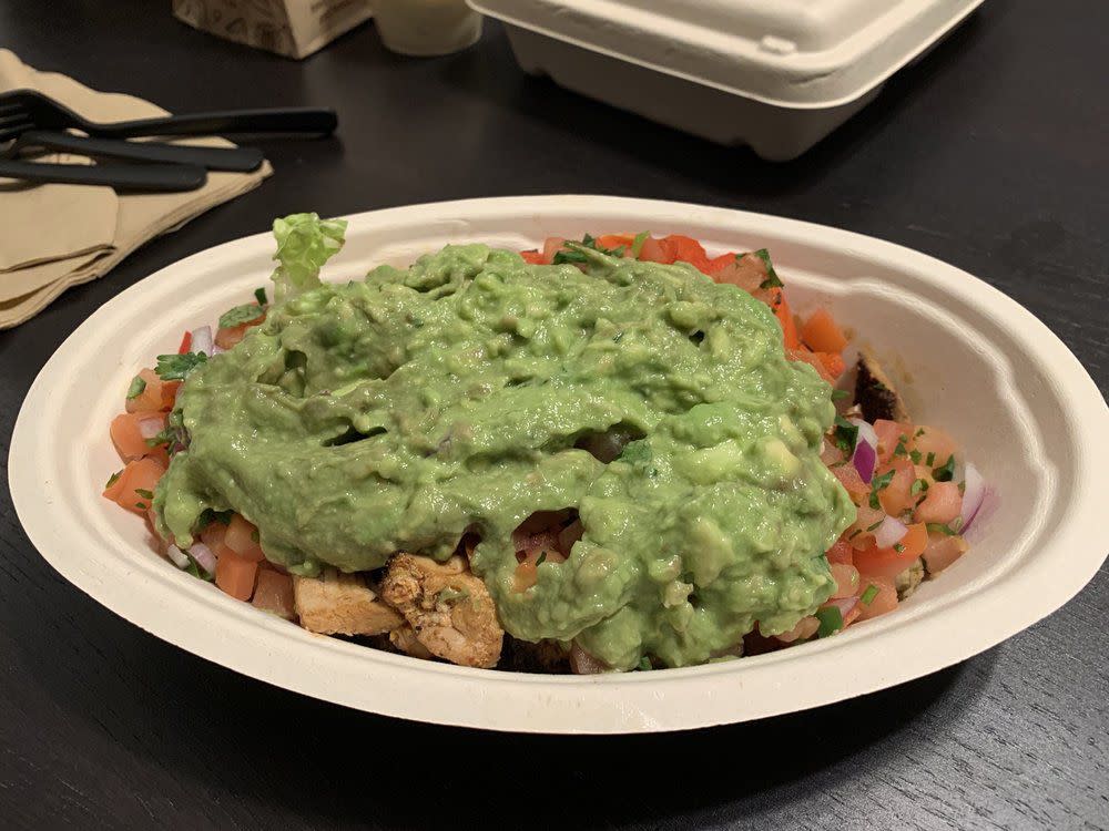 Chipotle bowl with a large amount of guacamole