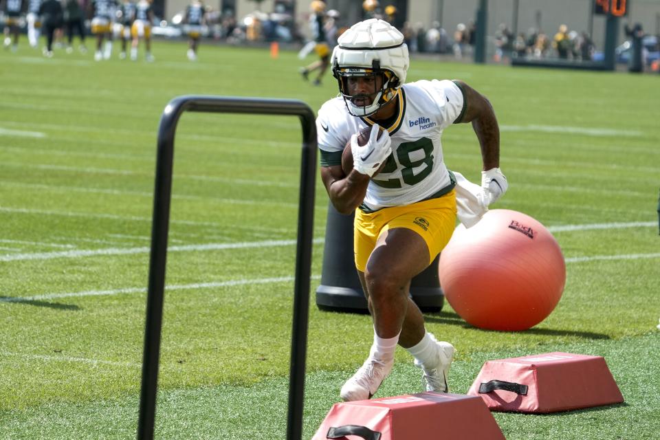 Green Bay Packers' AJ Dillon runs during NFL football training camp Thursday, July 27, 2023, in Green Bay, Wis. (AP Photo/Morry Gash)