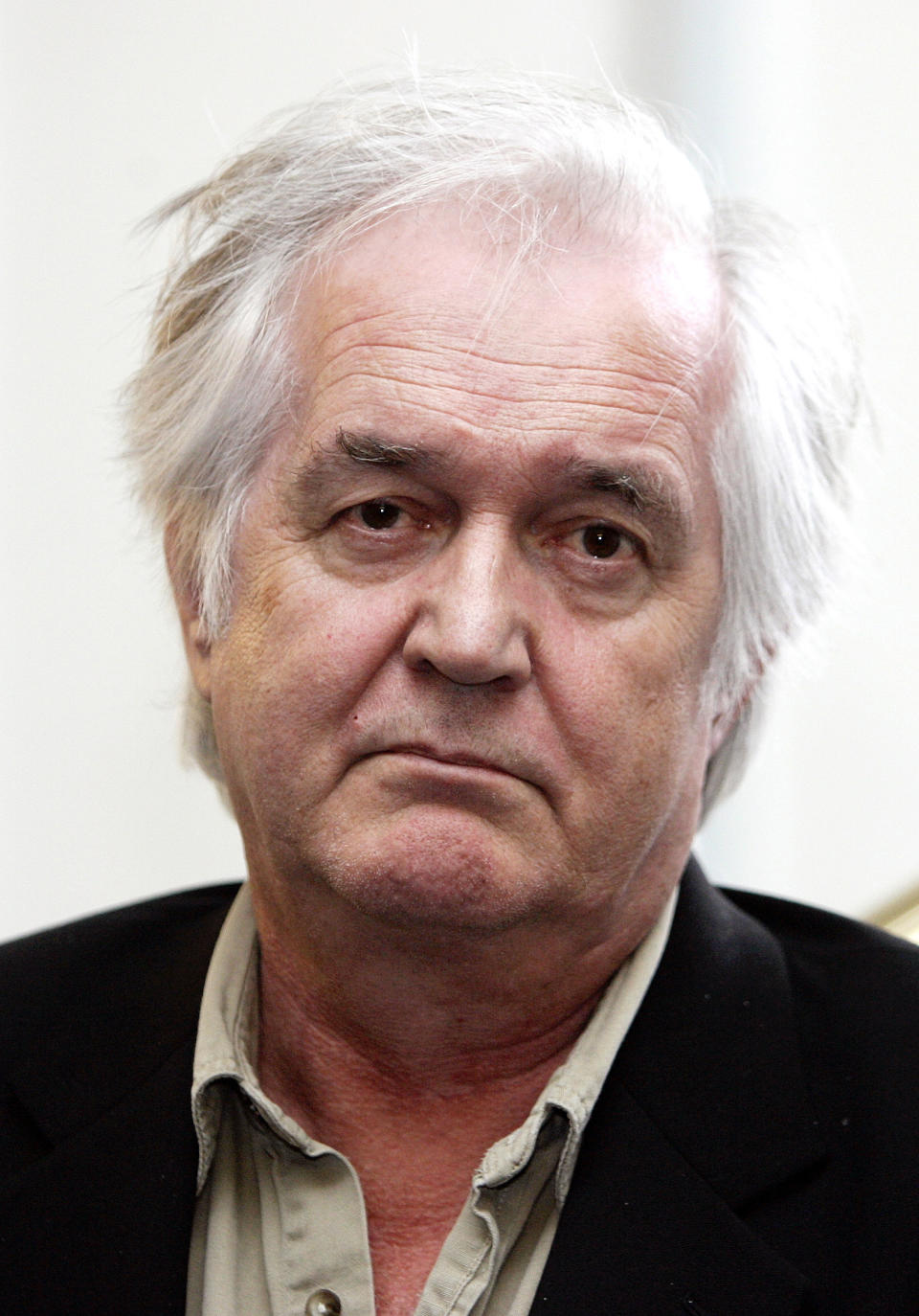 FILE - In this Tuesday, April 11, 2006 file photo, Swedish crime writer Henning Mankell gestures during a photocall in Hamburg, northern Germany. Mankell wrote on his website Wednesday, Jan. 29, 2014 that he received “a serious diagnosis of cancer” after going to a hospital to check out a hernia in the neck. Mankell is best known for his mystery novels featuring the gloomy inspector Kurt Wallander. (AP Photo/Fabian Bimmer, File)