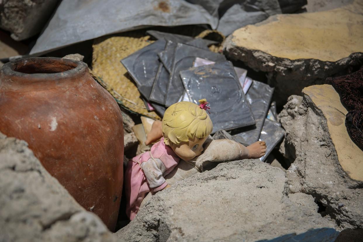 A doll lays in the rubble of a house destroyed by the earthquake in Camp-Perrin, Les Cayes, Haiti on Sunday, Aug. 15, 2021.