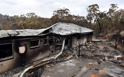 A view of a house damaged by recent catastrophic bushfires in the Southern Highlands village of Balmoral - Credit: Rex