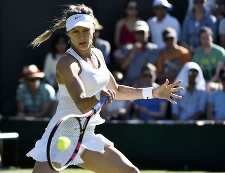 Eugenie Bouchard of Canada hits the ball during her match against Ying-Ying Duan of China at the Wimbledon Tennis Championships in London, June 30, 2015. REUTERS/Toby Melville