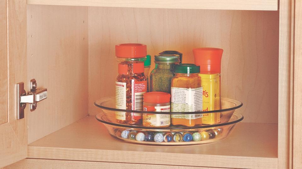 A DIY lazy Susan showing how to organize a small pantry