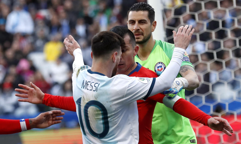 Argentina's Lionel Messi, left, and Chile's Gary Medel argue during Copa America third-place soccer match at the Arena Corinthians in Sao Paulo, Brazil, Saturday, July 6, 2019. (AP Photo/Victor R. Caivano)