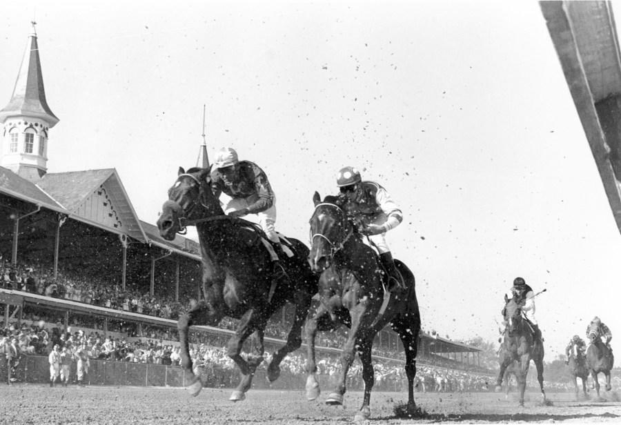 FILE – Lucky Debonair and jockey Bill Shoemaker are seen coming ahead in the final challenge to win the Kentucky Derby at Churchill Downs in Louisville, Ky., on May 1, 1965. America’s longest continuously held sporting event turns 150 years old Saturday. The Kentucky Derby has survived two world wars, the Depression and pandemics, including COVID-19 in 2020, when it ran in virtual silence without the usual crowd of 150,000. (AP Photo/File)