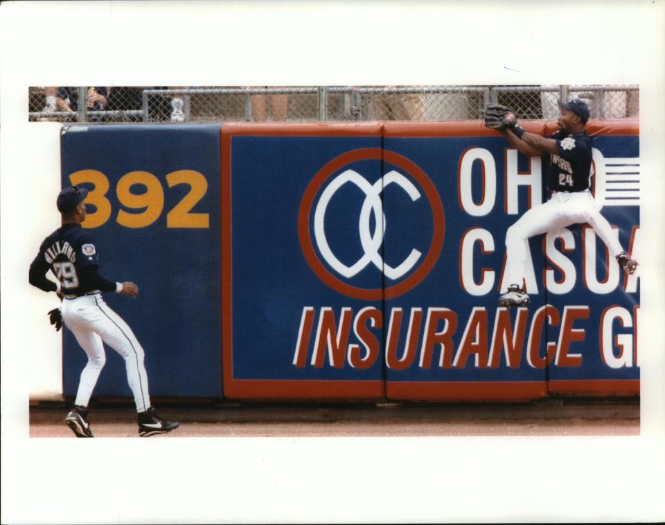 Chuck Carr (right) flies to the wall for a catch in 1997.