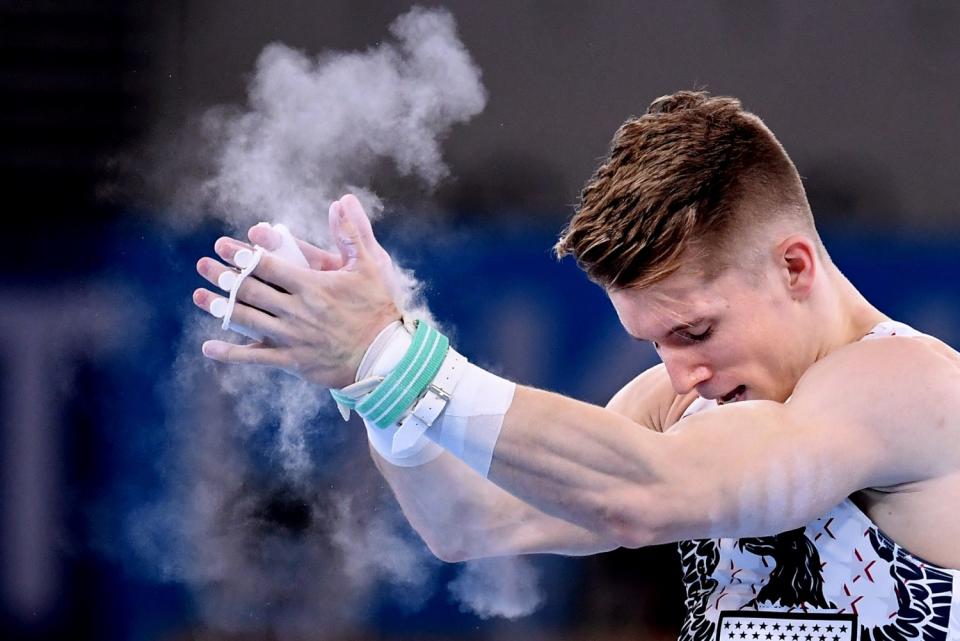 USA's Shane Wiskus celebrates after competing on the high bar.