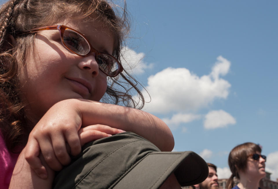 Peedie Flaherty, 4, sits atop her father's shoulders and watches the band Shovels & Rope perform during the inaugural Shaky Knees Music Festival on Sunday, May 5, 2013, in Atlanta. (AP Photo/Ron Harris)