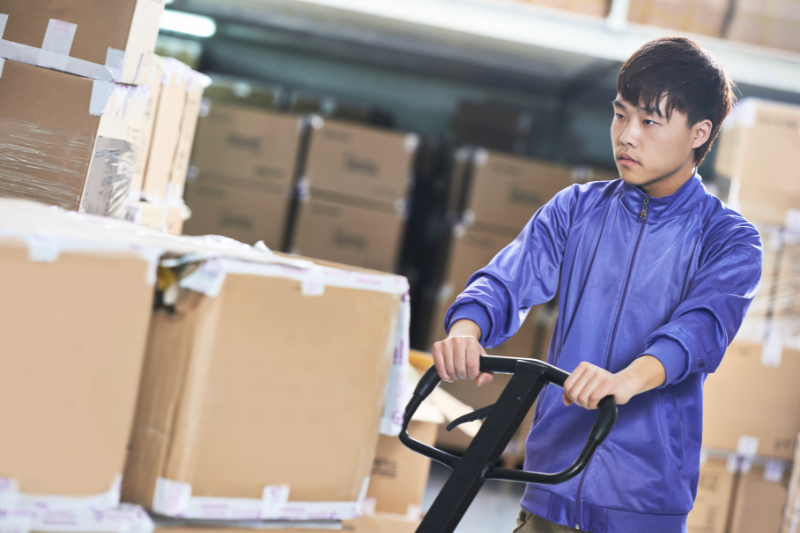 Man Pushing Pallet Stacker