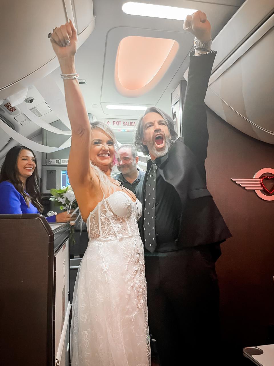 Photos from Pam and Jeremy Salda's  in-flight wedding, after a flight cancelation made them miss their elopement to Las Vegas. Photos provided.