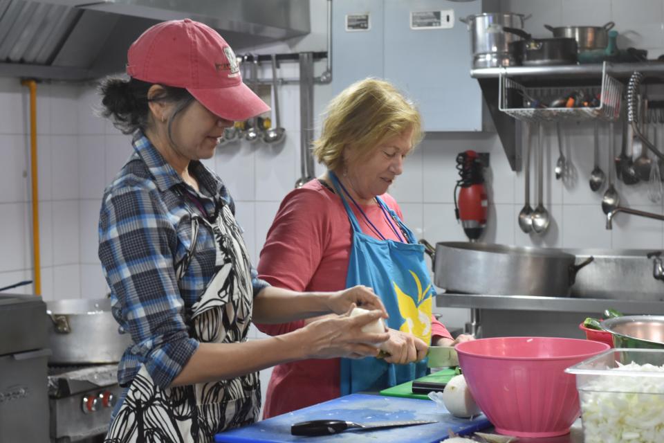 Volunteers at the Kino Border Initiative shelter preparing food for the incoming migrants.