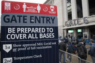 Spectators wait on a security line outside Yankee Stadium before an opening day baseball game against the Toronto Blue Jays, Thursday, April 1, 2021, in the Bronx borough of New York. Fans are back at the ballpark in limited numbers after they were shut out completely during the regular season last year due to the COVID-19 pandemic.(AP Photo/John Minchillo)