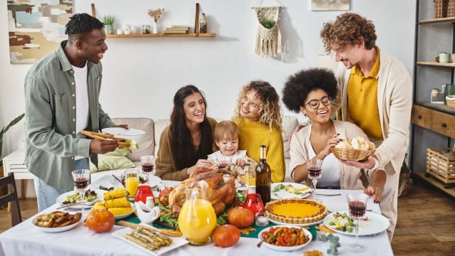 A group shares a traditional Thanksgiving meal.