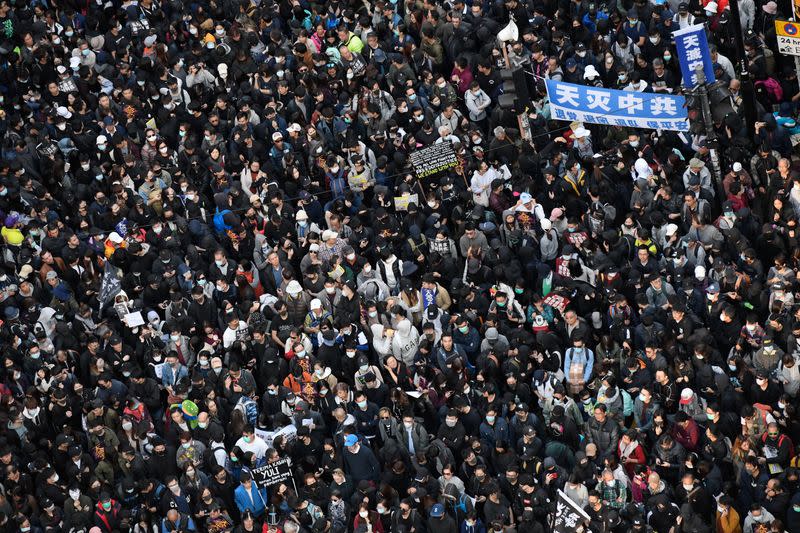 People attend a Human Rights Day march