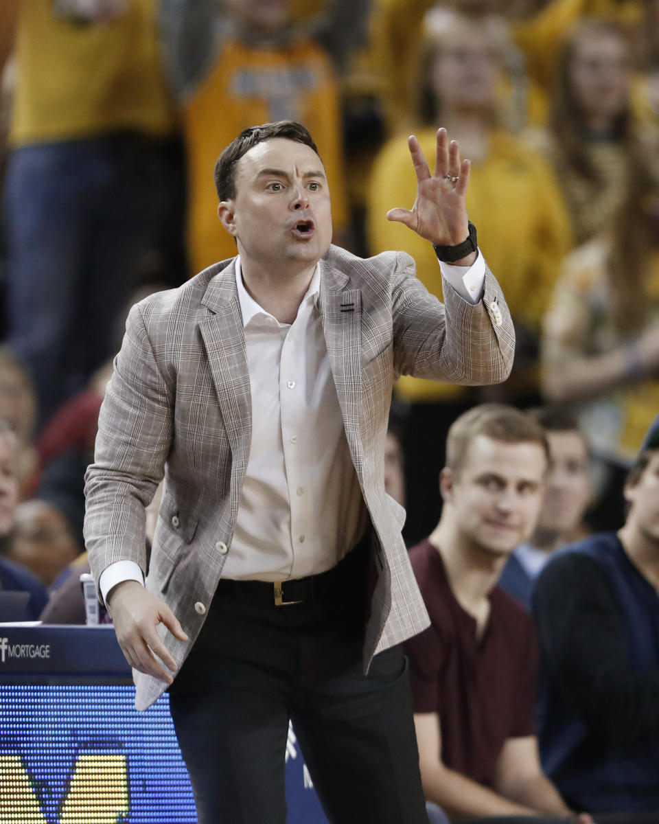 Indiana coach Archie Miller signals during the second half of the team's NCAA college basketball game against Michigan, Sunday, Feb. 16, 2020, in Ann Arbor, Mich. (AP Photo/Carlos Osorio)