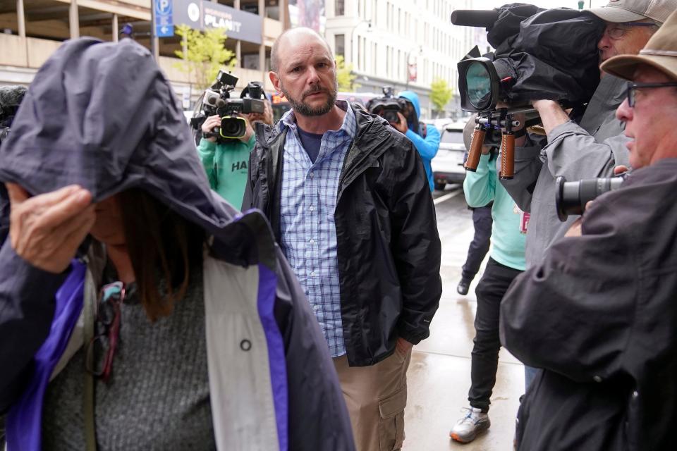 Members of Jack Teixeira's family, left and center, arrive at federal court on Thursday in Worcester, Mass. Teixeira, a Massachusetts Air National Guardsman, has been charged with leaking highly classified military documents.