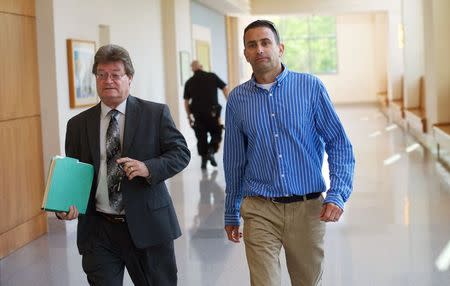 Andrew Biddle (R), 45, exits the Atlantic County Courthouse with his attorney, Mark Roddy, in Mays Landing, New Jersey, United States, May 12, 2015. REUTERS/Mark Makela