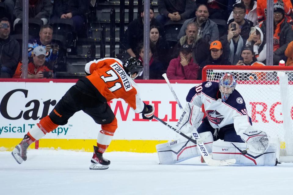 Columbus Blue Jackets' Daniil Tarasov, right, blocks a shot by Philadelphia Flyers' Tyson Foerster during a shootout in an NHL hockey game, Thursday, Jan. 4, 2024, in Philadelphia. (AP Photo/Matt Slocum)