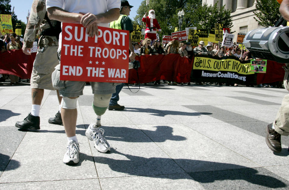 Image: A U.S. Army veteran who was injured in Afghanistan in 2004 protests during a march from the White House to the Capitol on Sept. 15, 2007. (Nicholas Kamm / AFP via Getty Images file)