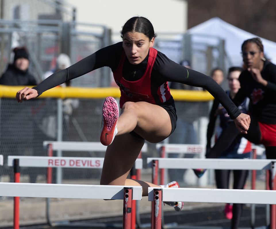 Kent Roosevelt's Lea Parham competes in the girls 100-meter hurdles at the Don Faix Invitational at Crestwood High School.